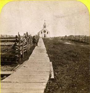"Boardwalk leading to St. Joseph's Catholic Church in La Pointe." Photograph by Whitney and Zimmerman, circa 1870. ~ Wisconsin Historical Society