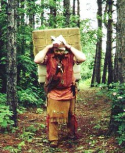 Recreation of a voyageur carriying two 90 lb packs of fur across a portage to avoid rapids or move to another river. ~ Saint Croix National Scenic Riverway